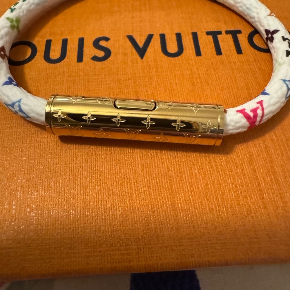 New Louis Vuitton White & Gold  Murakami Bracelet, never worn, excellent shape.